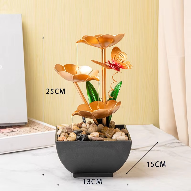 Decorative indoor water fountain with floral design and butterfly, shown with dimensions on a neutral background.