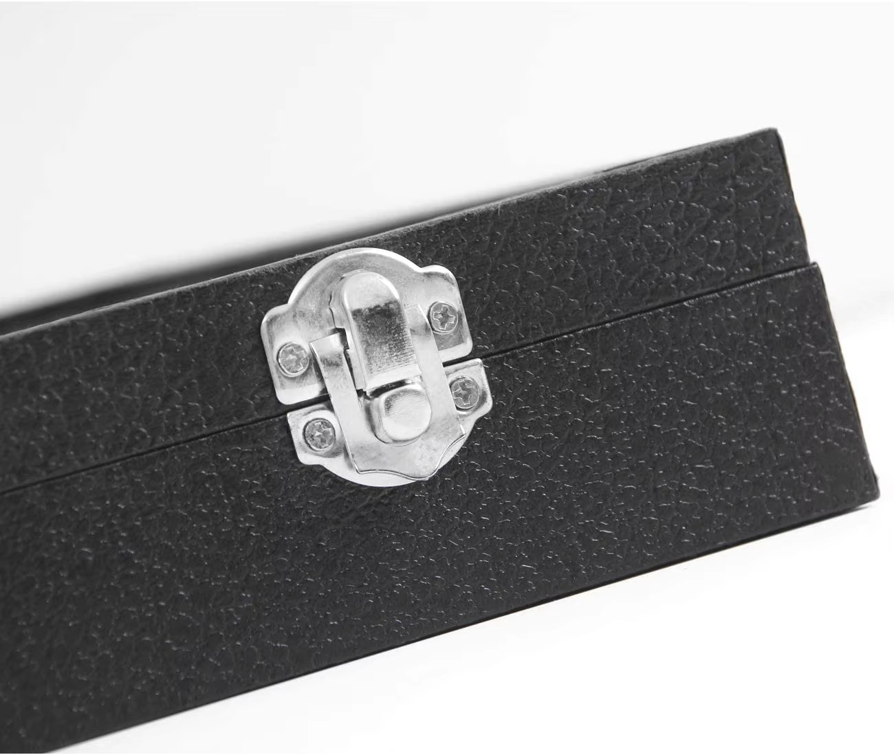 Black rectangular box with a silver latch on a white background