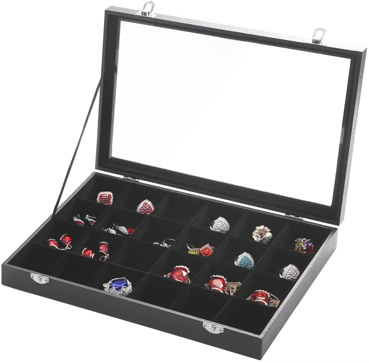 Black jewelry display case with glass top containing various earrings.