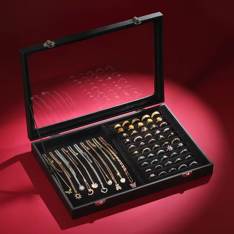 Jewelry set in an open black jewelry box on a red background