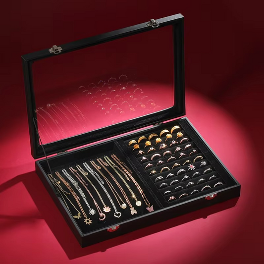 Jewelry set in an open black jewelry box on a red background