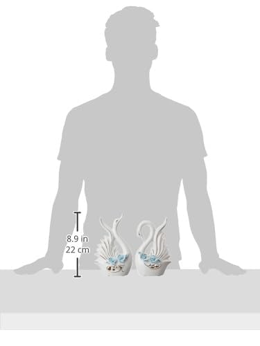 Two decorative swan figurines with a silhouette of a person for scale on a white background