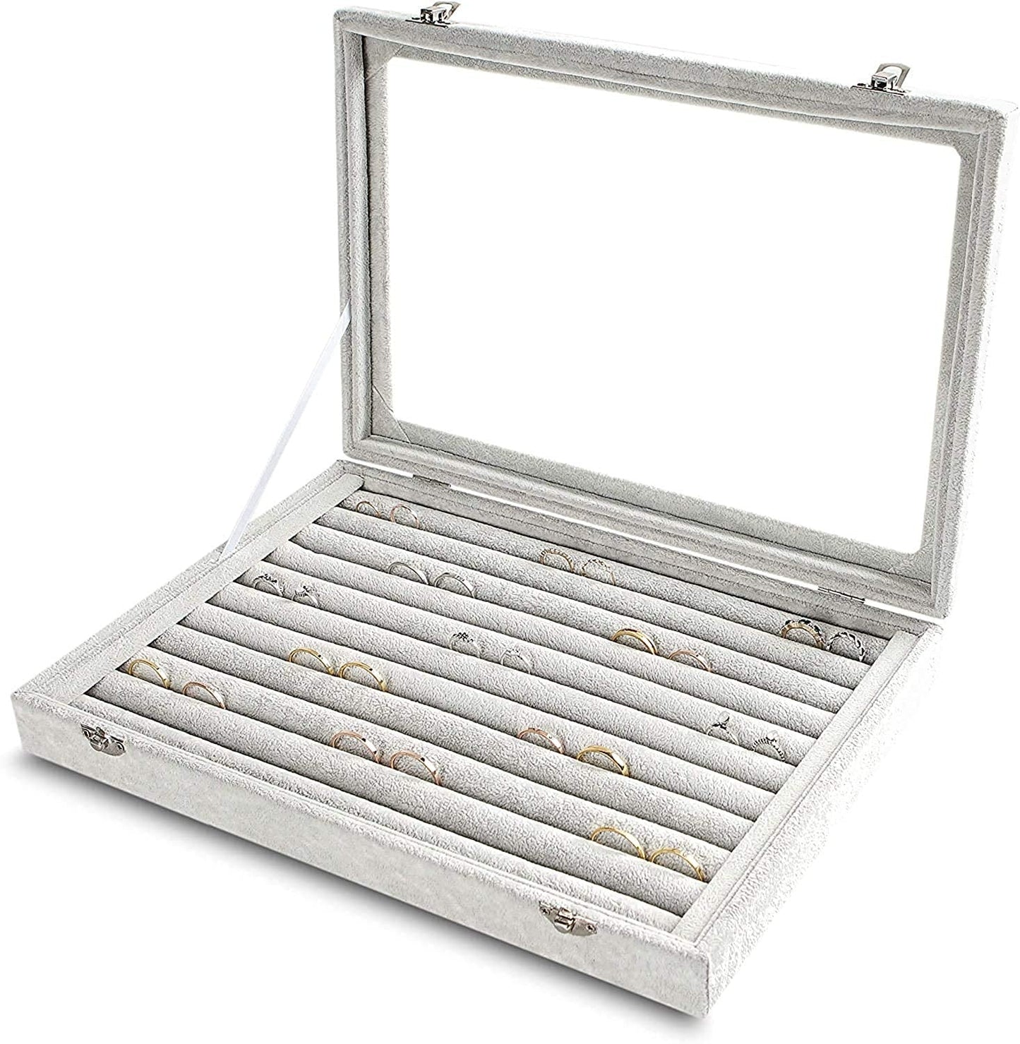 Silver jewelry display case with rings on a white background
