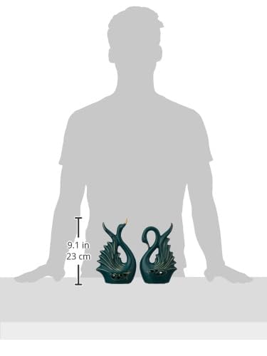 Teal dragon-shaped candles with measurements on a white background