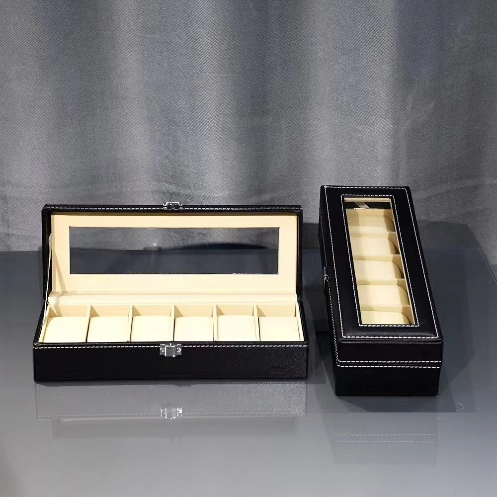 Black jewelry box with glass top on a gray background