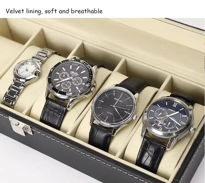 Four watches in a display case with a focus on velvet lining